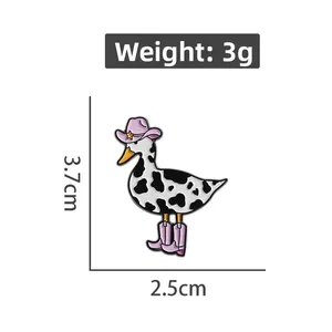 Detailed view of a cartoon cow-print duck enamel pin with size and weight dimensions