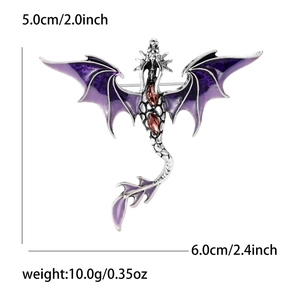 Western dragon brooch with purple enamel wings and red crystal accents on silver base
