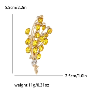 Golden wheat stalk brooch with yellow gemstones and white rhinestones, dimensions 5.5cm by 2.5cm