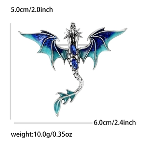 Detailed enamel dragon brooch in blue and green with navy blue crystals on silver alloy