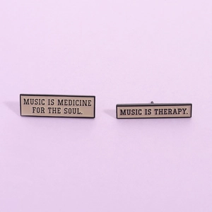 Minimalist enamel music series brooches with soulful quotes on light beige metal base