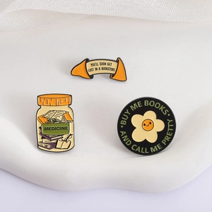 Three-piece enamel pins set featuring books and medicine bottle designs for readers