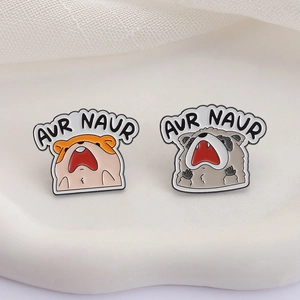 Cute enamel animal pins featuring screaming hamster and raccoon with AUR NAUR text design