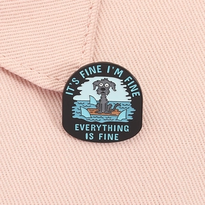 Detail of funny black dog on raft enamel pin with it is fine everything is fine text