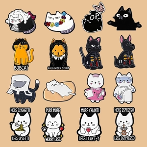 Flat lay of 16 cute cat enamel pins featuring diverse themes like nurse and scientist cats