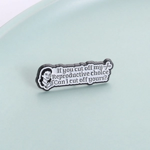 Cartoon feminist enamel pin badge with If you cut off my reproductive choice slogan