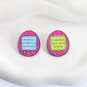 Cute pink retro electronic pet enamel brooch with star and heart details on white fabric