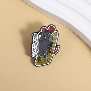 Detailed close-up of funny fitness mouse enamel pin on a green mousetrap base