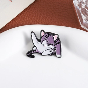 Creative enamel cat brooch featuring a purple stretching kitten on a white ceramic plate