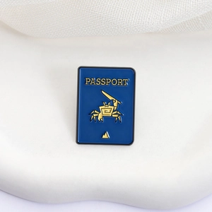 Creative blue passport enamel pin with golden crab and peak design for travelers