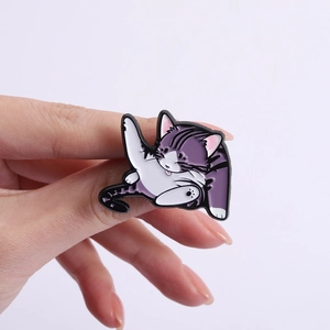 Cute purple cartoon cat enamel pin showing a playful kitten pose for bags and clothing