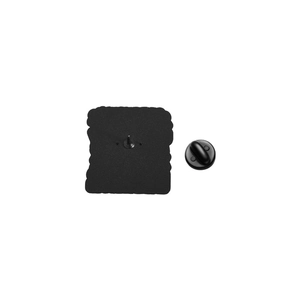 Detail view of the enamel pin back with black matte finish and rubber clutch fastener
