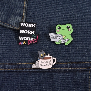 Detailed view of frog and black cat enamel pins on denim, office humor theme badges
