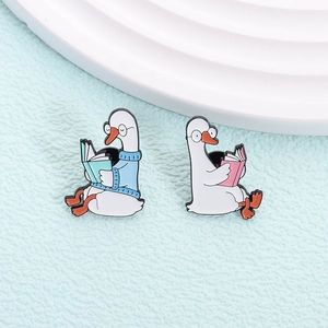 Cute enamel goose reading book pins with glasses and blue sweater for backpack and clothes