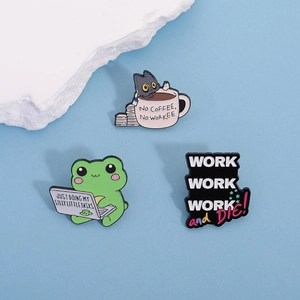 Three enamel pins featuring a cat and frog with funny work-related slogans on blue background
