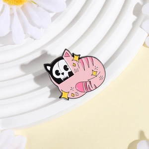 Close-up of pink skeleton cat enamel pin with yellow star details on a white display
