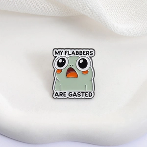 Cute green enamel frog pin with My Flabbers Are Gasted text on white background