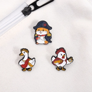 Three historical parody enamel pins featuring hamster, goose, and rooster on white canvas bag
