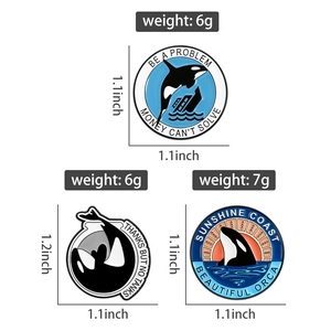 Detailed enamel pins set featuring orcas with environmental slogans and measurements