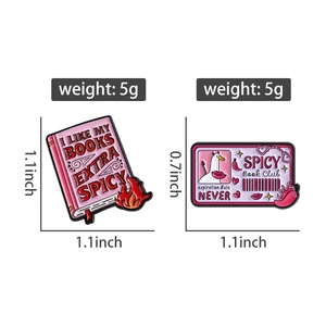 Detailed view of pink enamel book pins with Spicy Book Club and goose design details