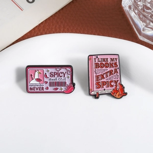 Pink spicy book club enamel pin set with cartoon duck and flame pattern on ceramic plate