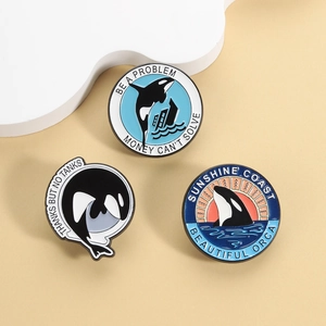Orca enamel pin set featuring three distinct ocean life designs with polished zinc alloy