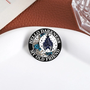 Dark style bat enamel pin with Hello Darkness My Old Friend text on white plate