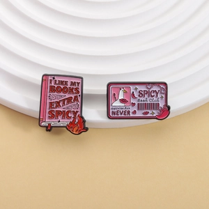 Pink spicy book club enamel pins set featuring I Like My Books Extra Spicy slogans