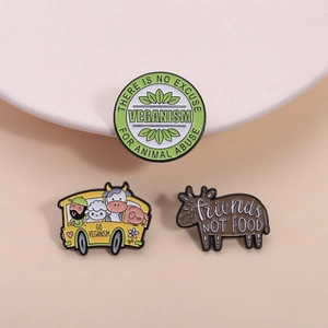 Vegan enamel pin set featuring animals and slogans like Friends Not Food and Go Veganism
