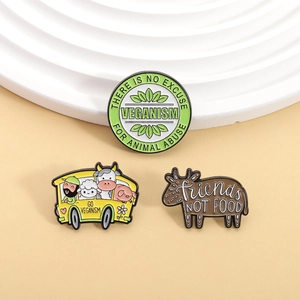Three-piece vegan enamel pin set with Friends Not Food and animal protection themes