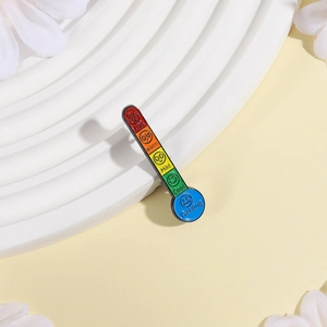 Creative thermometer mood enamel pin with colorful five-level scale on white display