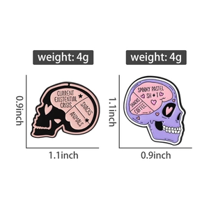Detailed view of skull enamel pins with humorous text, showing dimensions and 4g weight