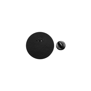 Close-up of duck enamel pin back with secure black rubber clutch and butterfly needle