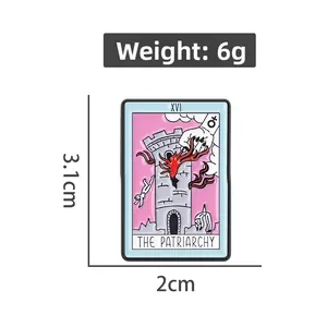 Detail view of XVI Tarot The Tower enamel pin measuring 3.1cm in height and 2cm in width