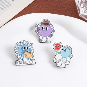 Cartoon biology enamel pins featuring dendritic cell, NK cell, and regulatory T-cell