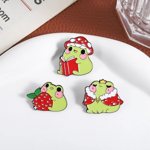 Three cute frog enamel pins set featuring strawberry prince and mushroom hat designs