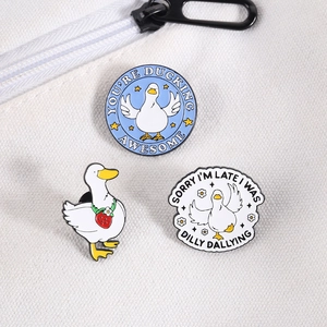 Detailed set of duck enamel pins with strawberry and humor quotes on a canvas background