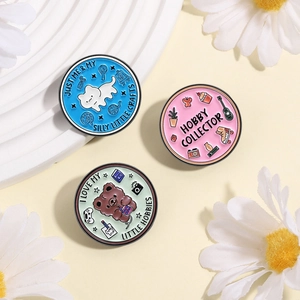 Three cute animal enamel pins with cat and bear illustrations for hobby collectors