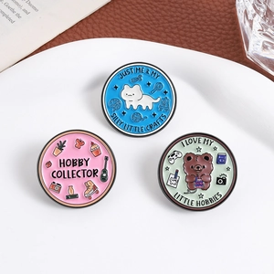 Three-piece set of round enamel pins with cute animal and hobby collection illustrations