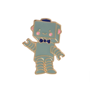 Detailed close-up of a mint green robot enamel brooch with gold-plated metal outlines