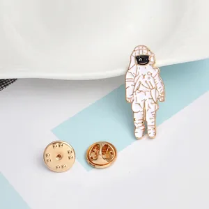 Creative astronaut enamel pin made of white alloy with gold trim and butterfly clutch back