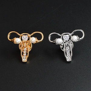 Gold and silver uterus alloy brooches with heart crystal and pearl embellishments