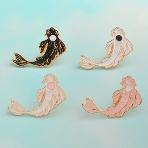 Detailed close-up of four-piece koi fish enamel brooches in gold plating and colorful drip oil