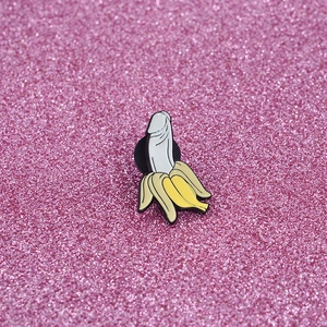 Detailed view of creative enamel pin with a funny banana mashup design and metal pin back