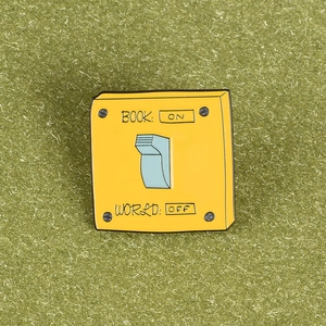 Cute square enamel pin with ON-OFF switch design on a green background