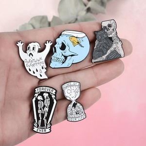Set of punk style enamel pins featuring ghost skeleton cat and hourglass motifs