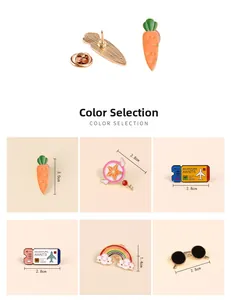 Detailed close-up of cartoon enamel pins including carrot, rainbow and airplane ticket styles