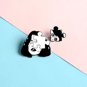 Artistic puzzle enamel brooch set featuring a female face portrait in black and white finish
