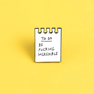 Cartoon notebook enamel lapel pin with To Do Be Fucking Incredible handwritten text