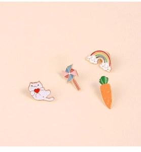 Set of four cute cartoon enamel brooches with white cat, windmill, rainbow and carrot shapes